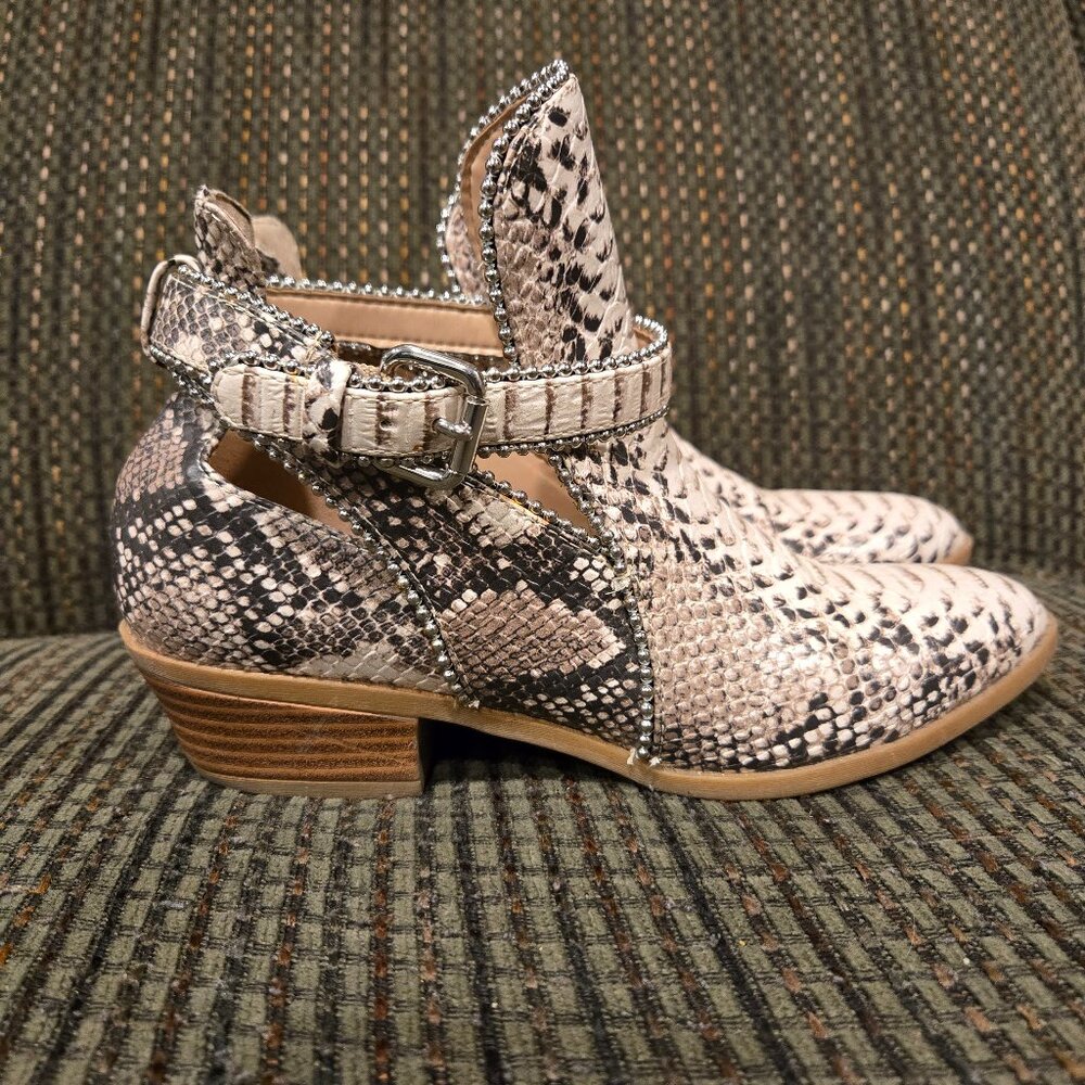 Snake printed boots by BCBG